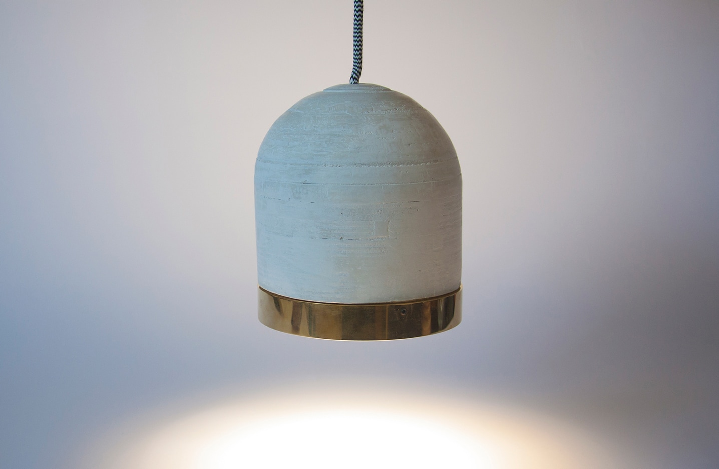 Iris cement and brass pendant lighting